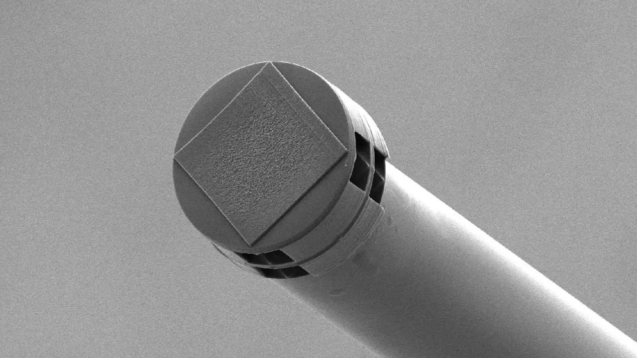 An AI sensor barely the size of a grain of salt. Image USST